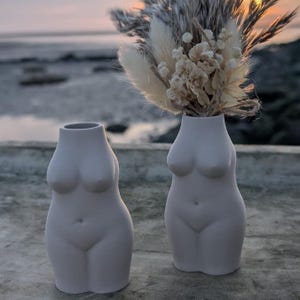 Female breast vase