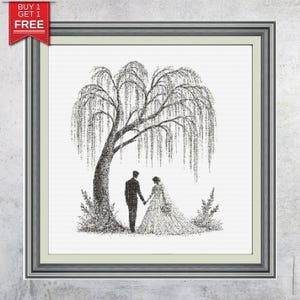 May include: Framed black and white artwork depicting a couple holding hands under a weeping willow tree. The artwork is in a silver frame and features a Buy 1 Get 1 Free promotion tag in the upper left corner. The image is a romantic wedding or anniversary theme.