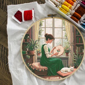 girl embroidering by window cross stitch pattern, cozy room with cat and plants, peaceful handmade home scene