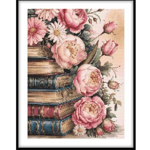 May include: A cross-stitch embroidery pattern featuring a stack of five vintage-style books with gold-edged pages, topped with a lush arrangement of pink peonies, rosebuds, and white daisies, all framed within a simple black rectangular border.