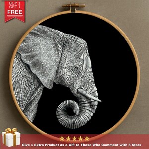 May include: Black and white elephant drawing in a wooden embroidery hoop. The detailed pen and ink illustration features the elephant's head and trunk against a black background. The text "BUY 1 GET 1 FREE" is in the top left corner.