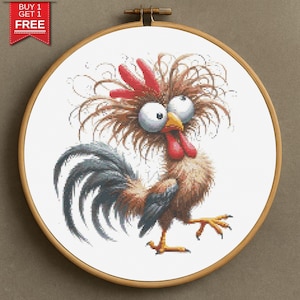 May include: A cross-stitch embroidery of a cartoon rooster with exaggerated features, including large googly eyes, a red comb and wattle, and a fluffy brown body. The rooster is set in a wooden embroidery hoop. The text "BUY 1 GET 1 FREE" is in the upper left corner.