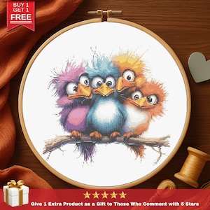 May include: A cross-stitch embroidery hoop with four cartoon birds on a branch. The birds are in purple, blue, orange, and yellow. The text "BUY 1 GET 1 FREE" is in the upper left corner. The text "Give 1 Extra Product as a Gift to Those Who Comment with 5 Stars" is at the bottom.