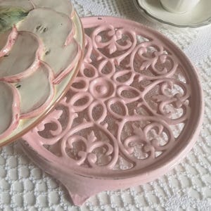 Antique vintage pink cast iron trivet