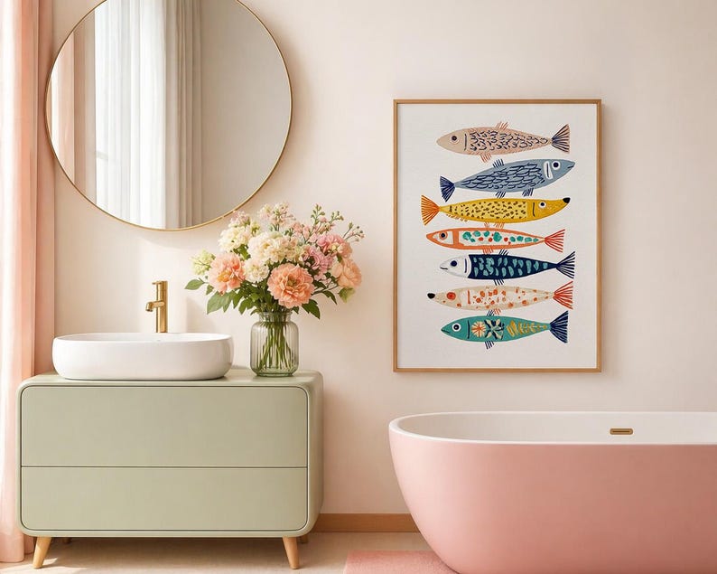 May include: A framed art print featuring seven colorful fish illustrations. The fish are in various colors, including pink, blue, yellow, and orange, with detailed patterns. The artwork is displayed in a bathroom setting with a pink bathtub and a light green vanity.