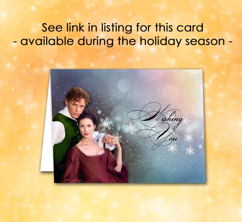 May include: Greeting card featuring a couple in period attire, with the words "Wishing You" in elegant script. The background has a soft, blurred effect with snowflakes. The card is available during the holiday season.