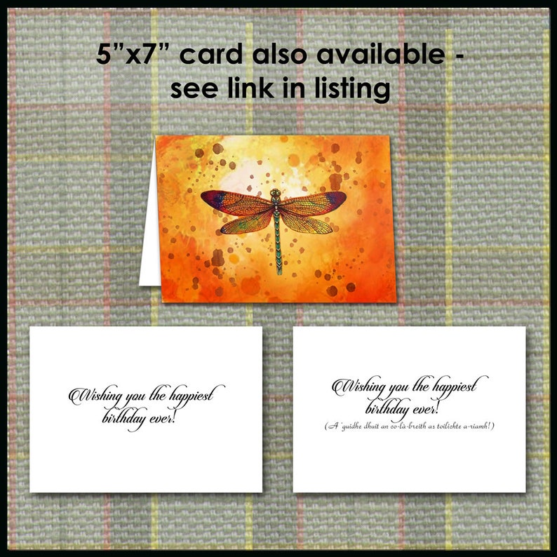 May include: Greeting card with a watercolor dragonfly design in orange and yellow hues. The card reads "Wishing you the happiest birthday ever!" and is available in a 5"x7" size. See the listing for details.