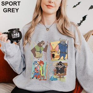 Puede incluir: Sudadera gris deportiva con un gr&aacute;fico de dibujos animados de personajes. El dise&ntilde;o incluye un perezoso, un zorro, un b&uacute;falo y otros personajes. La sudadera tiene las palabras "SPORT GREY" impresas en la parte superior.
