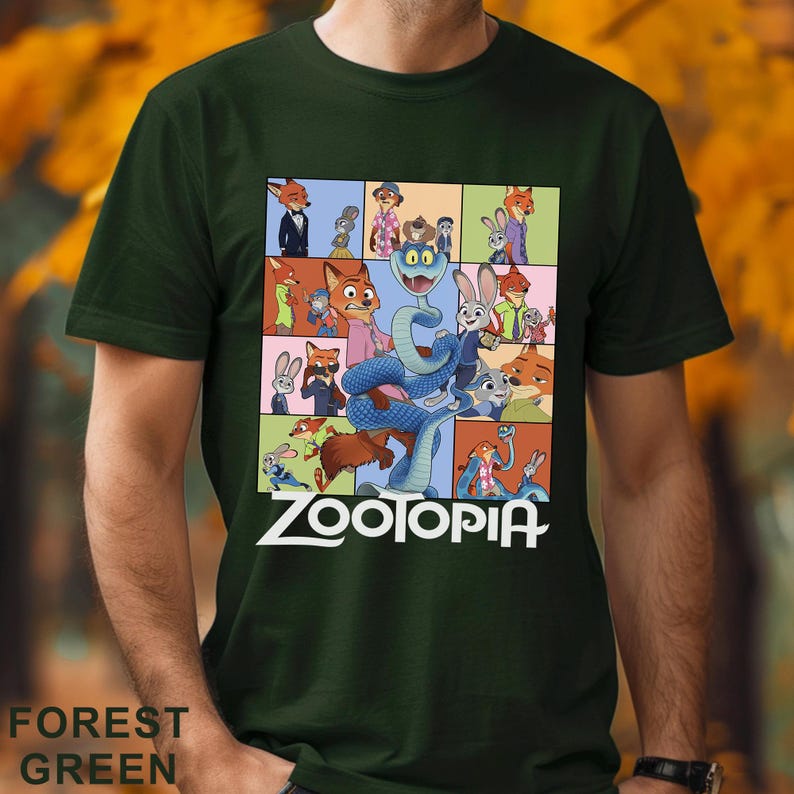Peut inclure: T-shirt vert for&ecirc;t avec un motif color&eacute; du film d'animation Zootopie. Le design pr&eacute;sente divers personnages et le titre du film en blanc. Le t-shirt est fait d'une mati&egrave;re douce.