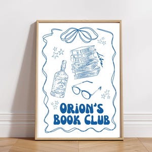 May include: A blue and white illustration of a stack of books, a bottle of liquor, glasses, and stars. The text "Orion's Book Club" is written in blue letters.