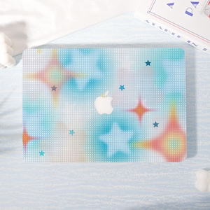 May include: A laptop cover with a colorful design featuring stars and a white Apple logo. The cover has a light blue background with a dotted pattern and colorful starbursts in orange, yellow, and blue.
