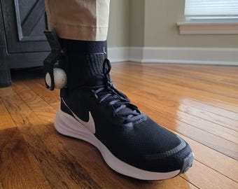 The Original Crooked Caddy ! Golf ball ankle holder gag gift for cheating golfers hides a gold ball in pants. Awesome prank on the course!