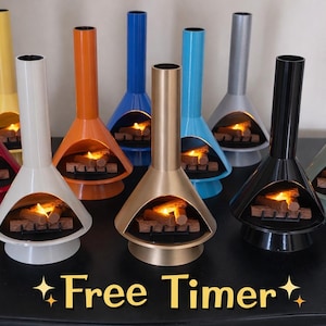 May include: A collection of colorful, retro-style tabletop fireplaces. Each fireplace has a unique color, including red, yellow, orange, blue, gold, teal, gray, black, and green. The fireplaces have a flame effect inside. The text "Free Timer" is at the bottom.