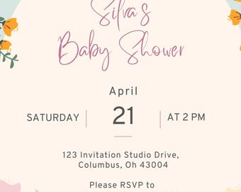 May include: A floral baby shower invitation with a light blue background and a white circle in the centre. The text in the circle reads "Please join us for Silva's Baby Shower" in pink script. The date and time of the shower are listed below: "Saturday, April 21 at 2 PM". The address and RSVP information are also included. The invitation is decorated with colourful flowers.