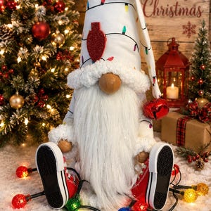May include: A decorative gnome figurine wearing a white hat patterned with colorful Christmas light bulbs and a large red glittery bulb accent. The gnome has a long white beard, a wooden nose, and wears red sneakers with white soles.