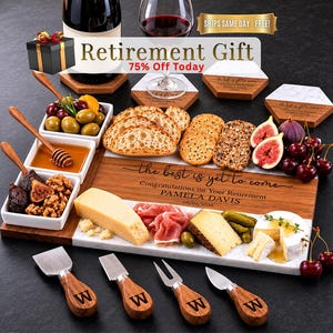 May include: A rectangular wooden and white marble charcuterie board engraved with the text the best is yet to come, Congratulations on Your Retirement, PAMELA DAVIS, 06/01/2026, accompanied by four cheese knives with wooden handles marked with a W.