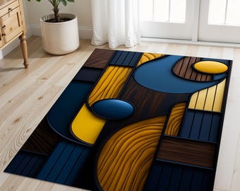 May include: A rectangular area rug with an abstract design. The rug features a combination of dark blue, yellow, and brown geometric shapes. The design includes oval and rectangular elements, creating a modern and artistic look. The rug is placed on a light wood floor.
