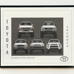 May include: Framed print showing the evolution of the Toyota 4Runner. Five white 4x4s are displayed against a grey topographic background. The Toyota logo is at the bottom right, with the text "TOYOTA" and "4RUNNER" on the sides.