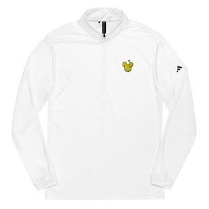 May include: White long-sleeved golf shirt with a quarter-zip collar. It has a yellow and green logo on the chest and the Adidas logo on the sleeve. The shirt is made of a lightweight, breathable material.