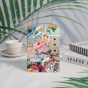 May include: A rectangular phone case featuring a collage of vintage-style illustrations. The design includes a horse, stamps with oranges, playing cards, and the words "Guest Check". The case has a glossy finish.