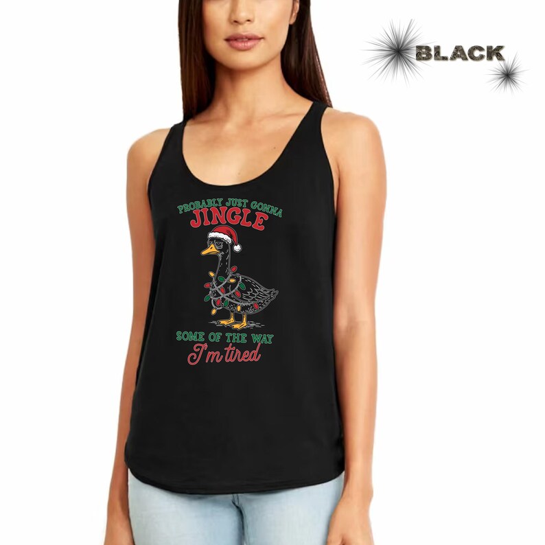May include: Black tank top featuring a cartoon duck wearing a Santa hat and Christmas lights. The text reads "Probably Just Gonna Jingle Some of the Way I'm Tired" in green and red lettering. The tank top is sleeveless.