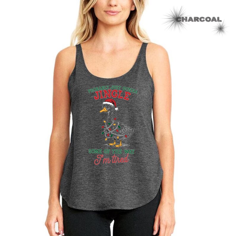 May include: Charcoal gray tank top with a Christmas goose graphic. The goose wears a Santa hat and is wrapped in Christmas lights. Text on the shirt reads "Probably Just Gonna Jingle Some of the Way I'm Tired."