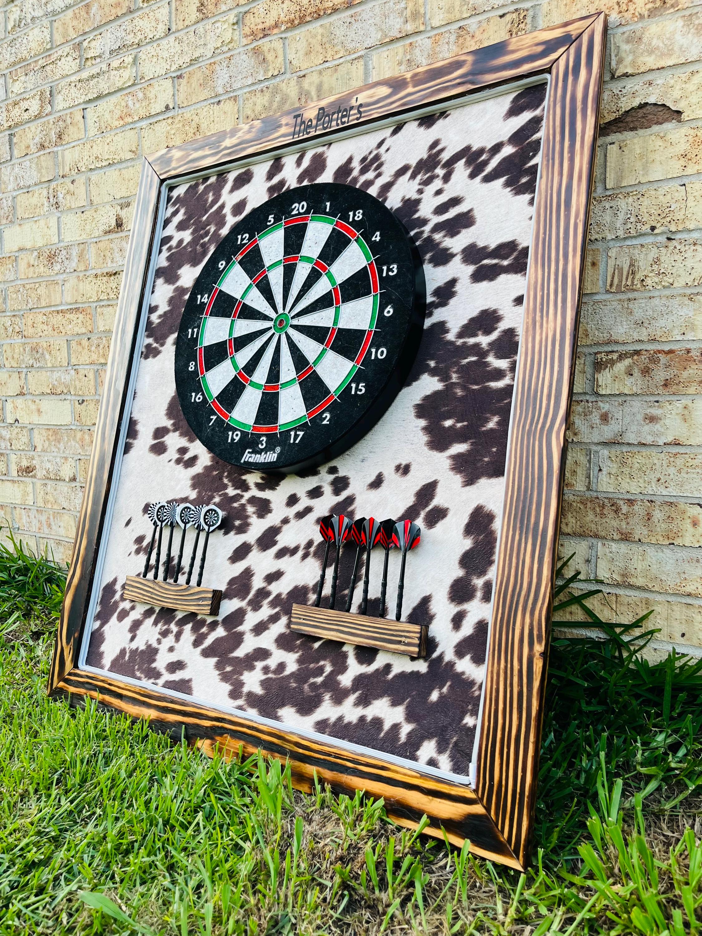 cowhide print dart board personalized with name