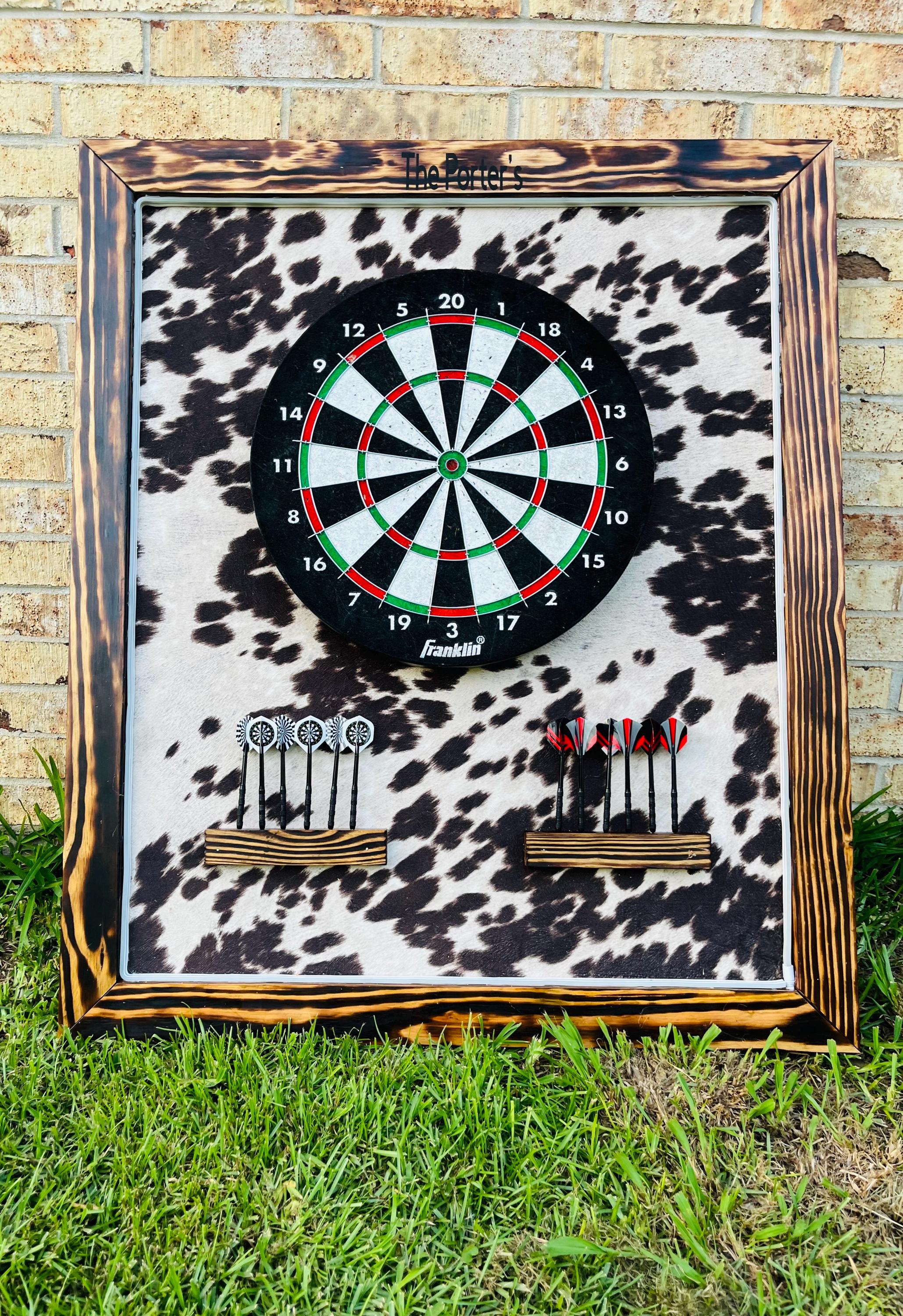 cowhide print dart board personalized with name