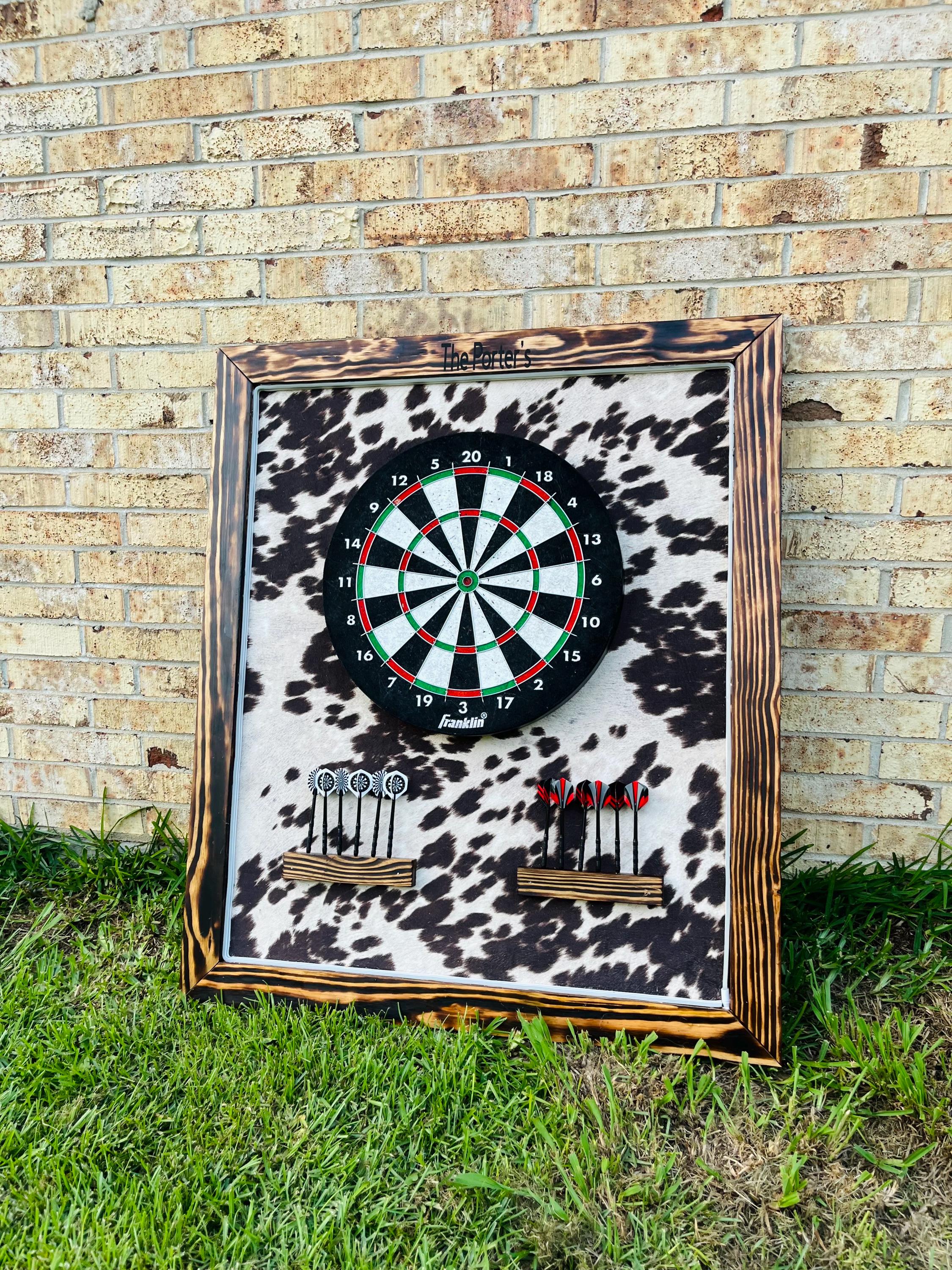 cowhide print dart board personalized with name