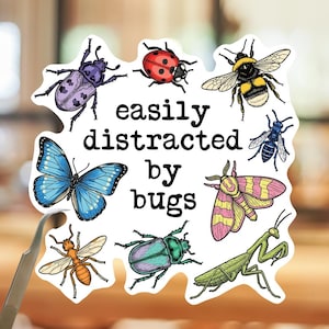 May include: A white die-cut sticker featuring the black text easily distracted by bugs surrounded by illustrations of a purple beetle, a red ladybug, a bumblebee, a blue butterfly, a blue wasp, a pink and yellow moth, an ant, a green beetle, and a mantis.