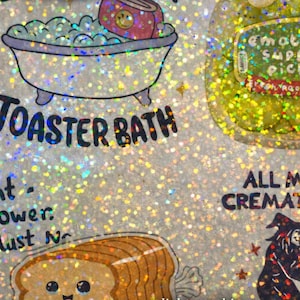 May include: A holographic sticker sheet with various cartoon illustrations. The sheet includes a bathtub with a toaster, a jar of pickles, and a loaf of bread. Text includes "LIVE LAUGH" and "TOASTER BATH".