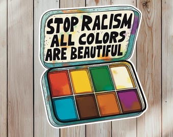 Pode incluir: Um autocolante com uma paleta de aguarela com o texto "STOP RACISM ALL COLORS ARE BEAUTIFUL". A paleta contém oito cores vibrantes: vermelho, amarelo, verde, creme, azul, castanho, laranja e roxo, numa caixa azul clara.