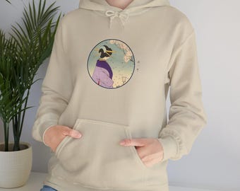 May include: Beige hoodie with a front pocket and drawstring hood. The hoodie features a circular graphic of a geisha in a purple kimono, with cherry blossoms and Japanese text. The design is centered on the chest.