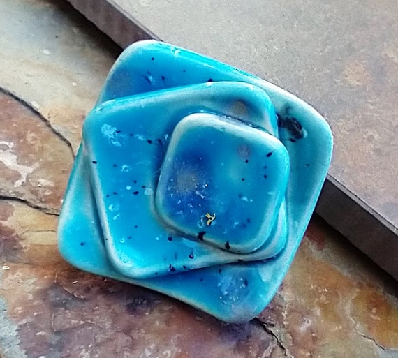 Transference in blue ceramic ring