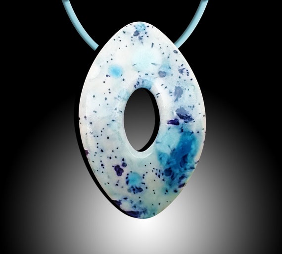 One-of-a-kind blue ink spotted ceramic football pendant