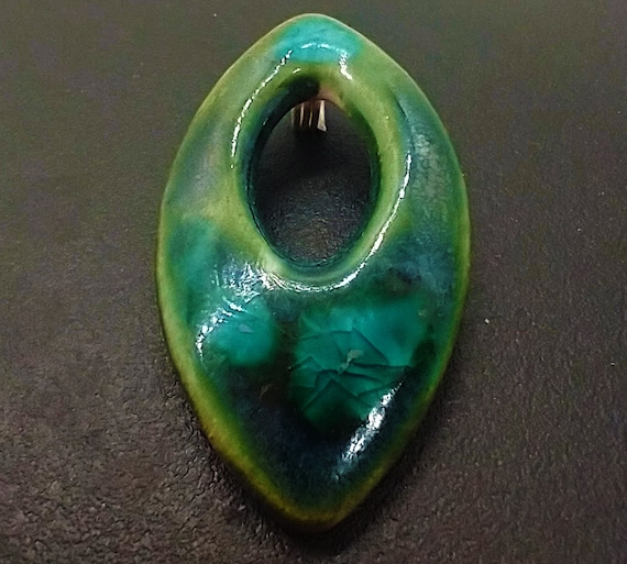 One-of-a-kind blue ink spotted ceramic football pendant