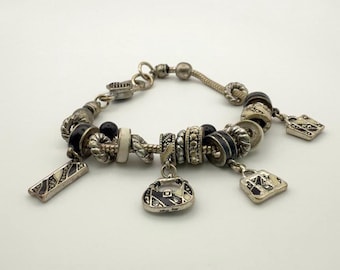 Boho Charm Bracelet: Black, Silver, & Enamel Purse Dangles