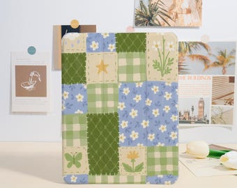 May include: A colorful patchwork design featuring squares of blue, green, and cream with floral and geometric patterns. The design includes a yellow star, a butterfly, and a flower. The item is likely a case or cover.