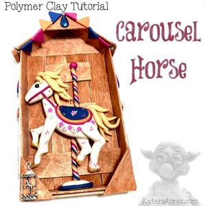 May include: A polymer clay carousel horse sculpture. The white horse has a floral design, a blue saddle, and a yellow mane and tail. The sculpture is set in a wooden frame with the words "Carousel Horse" in pink script.