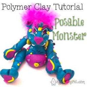 May include: Posable monster made from polymer clay. The monster is blue with yellow and pink accents. It has a pink feathery mane and is sitting with its legs crossed.