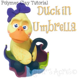 May include: A polymer clay sculpture of a yellow duck with an orange beak and a purple bow, sheltering under a colourful umbrella. The text "Duck in Umbrella" is displayed in gold lettering. The image is a tutorial from Sugar's Acres.