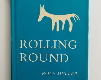 Rolling Round by Rolf Myller, 1963. First edition hardcover with dust jacket. Funny story about the invention of the wheel.