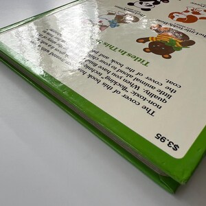 May include: A children's book with a green spine and a white cover featuring cartoon animal illustrations. The title is "Titles In This". The book has a price tag of &pound;3.16.