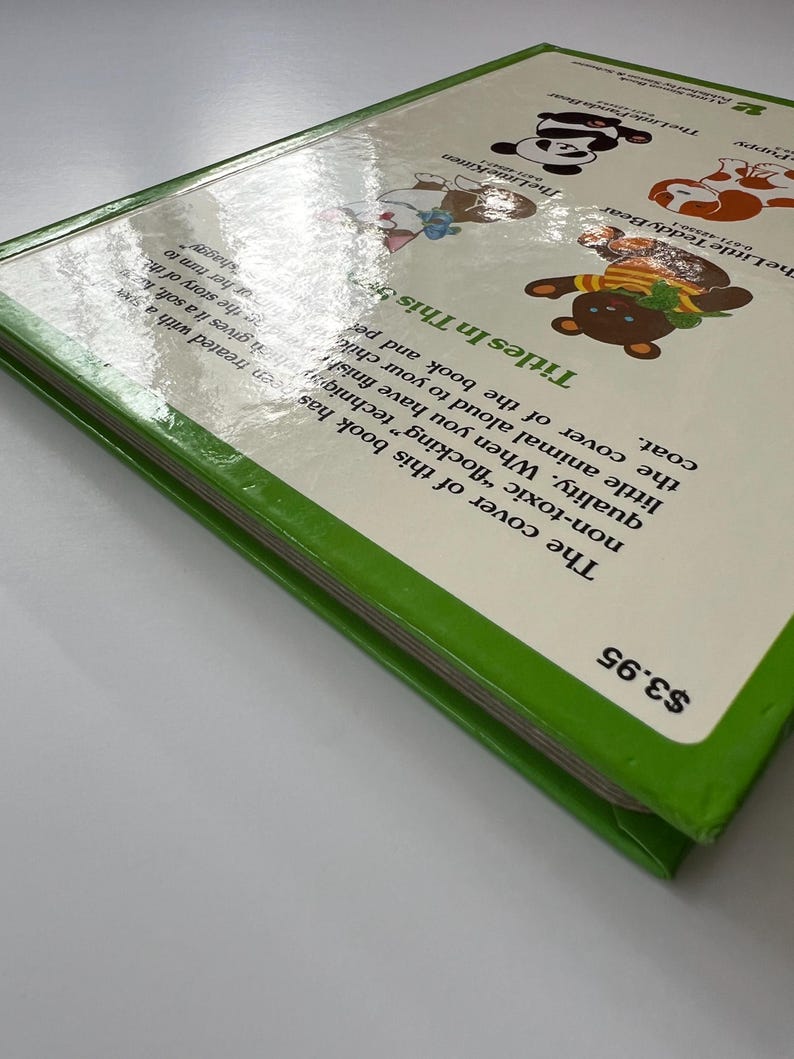 May include: A children's book with a green spine and a white cover featuring cartoon animal illustrations. The title is "Titles In This". The book has a price tag of &pound;3.16.