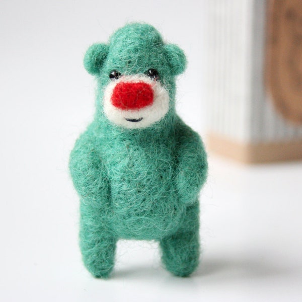 Bright greenish bear with a bright red nose, brooch 37