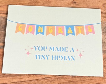Roliga små mänskliga grattisar, nyfödd hälsning, modern babyshowerpresent