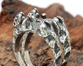 Otters holding hands rings set of two Sterling silver Blue Bayer Design NYC