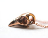 Tiny Bird Skull necklace in solid rose gold on a solid 14k rose gold chain