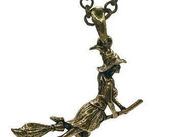 The witch pendant made in NYC yellow bronze