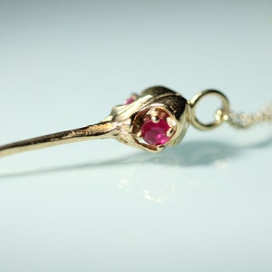 14k Solid Gold Hummingbird Skull faceted red garnet gemstone eyes from Blue Bayer Design NYC Fine Bird Skull Jewelry